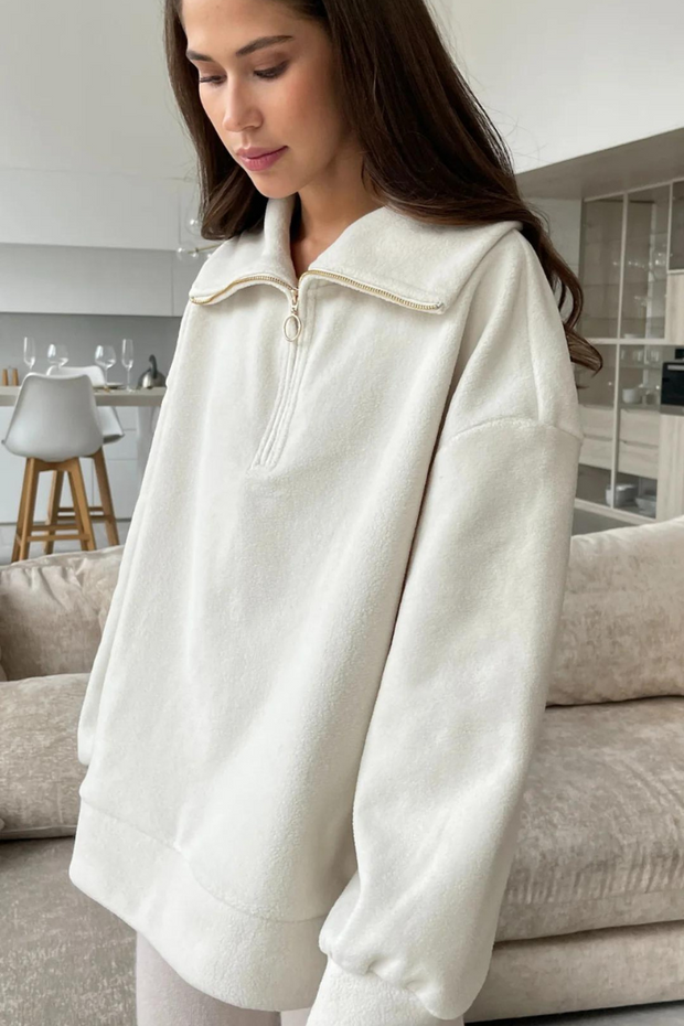 Off-white long sleeved half zip sweater