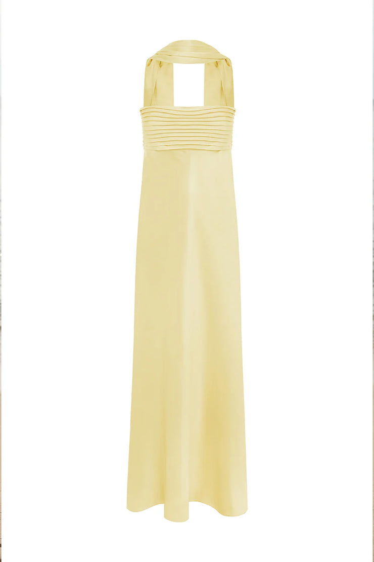 Long yellow dress with a pleated bodice on a white background