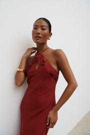 Woman wearing a red dress against a white background